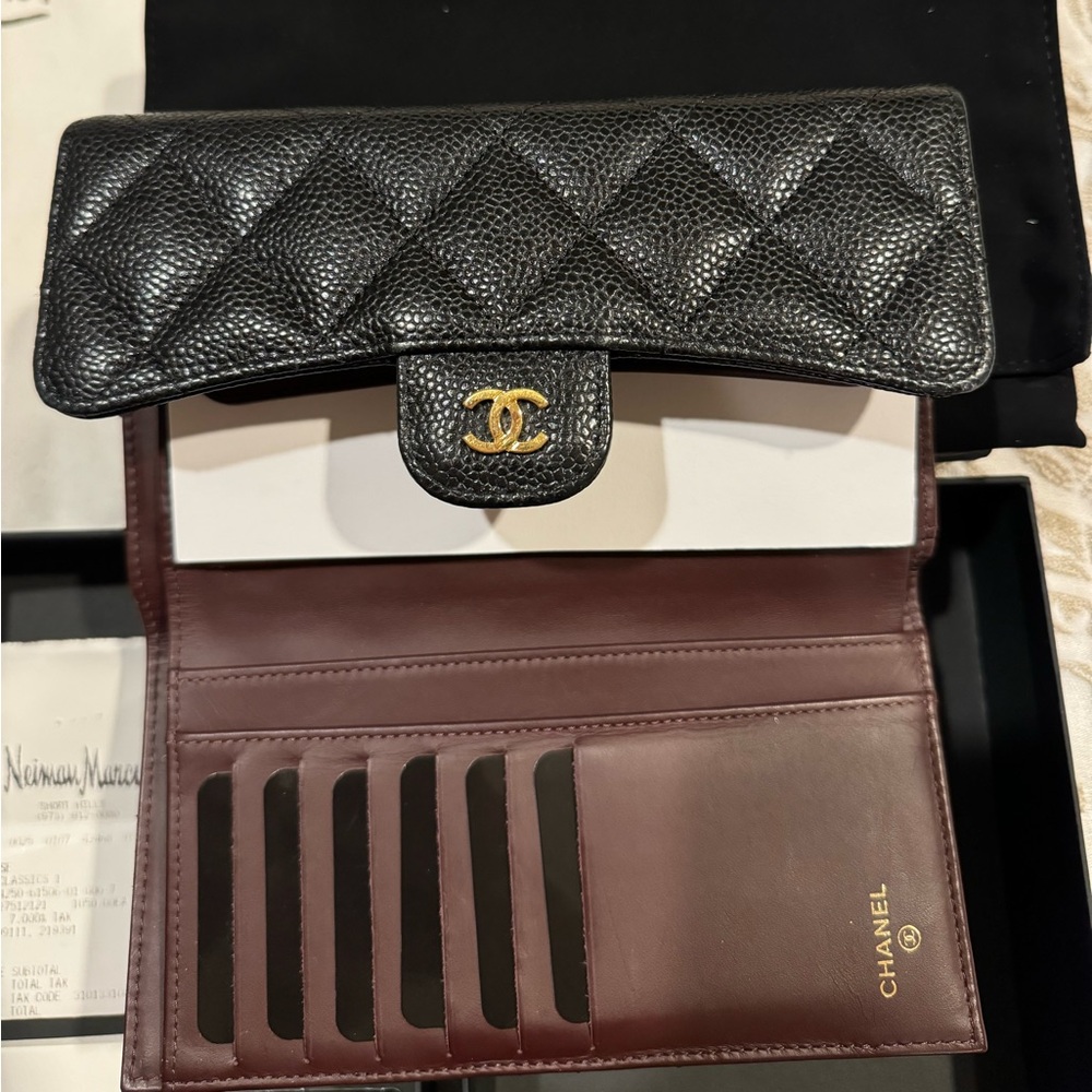 Chanel quilted caviar classic wallet in black.